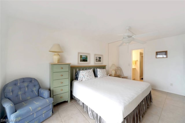 bedroom featuring ceiling fan and light tile floors