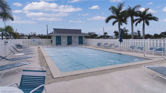 view of pool featuring an outdoor structure and a patio area