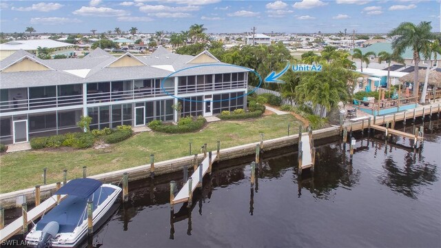 exterior space featuring a water view and a yard