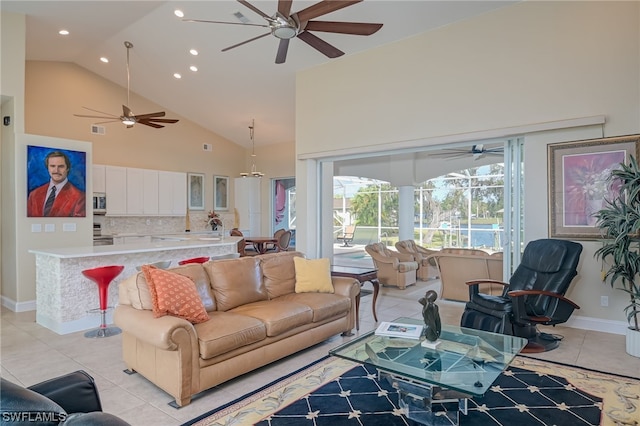 living room featuring light tile patterned floors and high vaulted ceiling