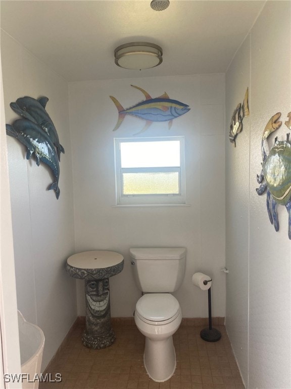 bathroom featuring toilet