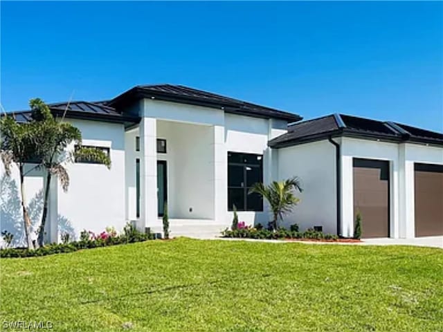 rear view of property featuring a yard