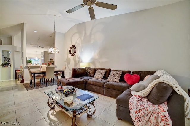 living room with light tile flooring, lofted ceiling, and ceiling fan with notable chandelier