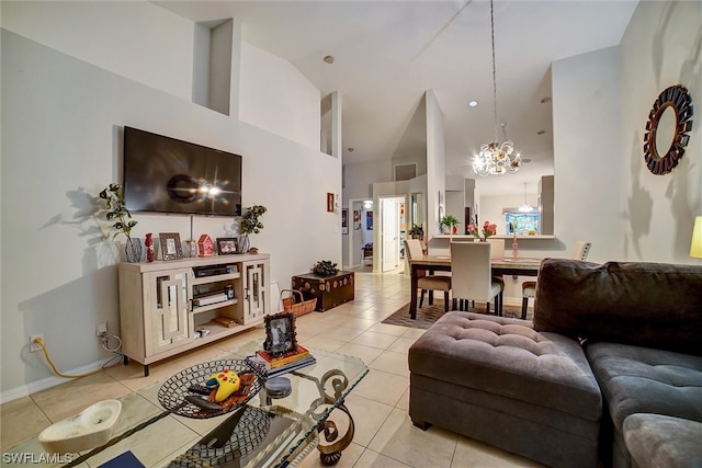 living room with light tile flooring, a chandelier, and high vaulted ceiling