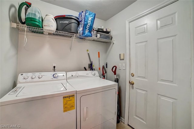 clothes washing area featuring washer and clothes dryer