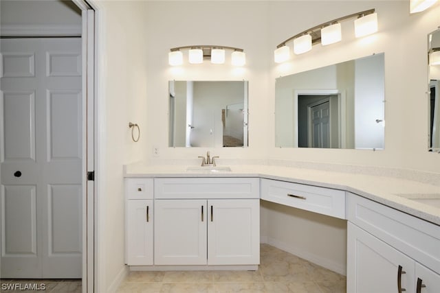 bathroom featuring tile floors and vanity