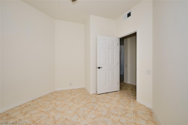 empty room with light tile flooring