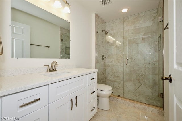 bathroom featuring walk in shower, toilet, vanity, and tile flooring