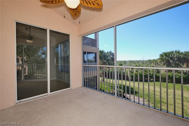 unfurnished sunroom featuring vaulted ceiling and ceiling fan