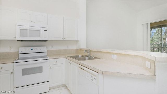 kitchen featuring white appliances, sink, and white cabinets