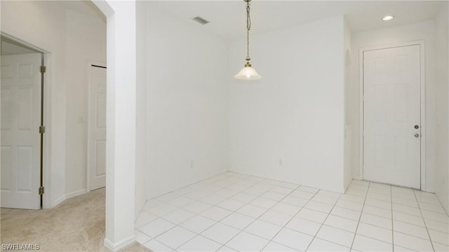 spare room with light colored carpet