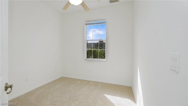 carpeted empty room with ceiling fan