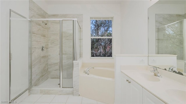 bathroom featuring tile patterned flooring, vanity, and separate shower and tub