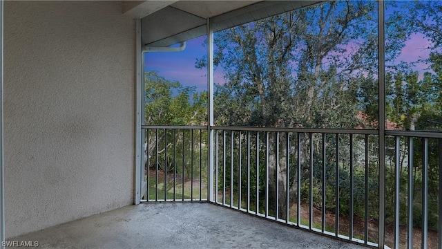 view of balcony at dusk