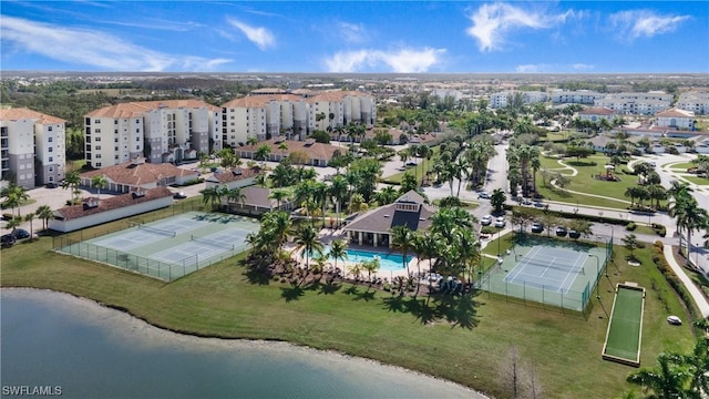 birds eye view of property with a water view