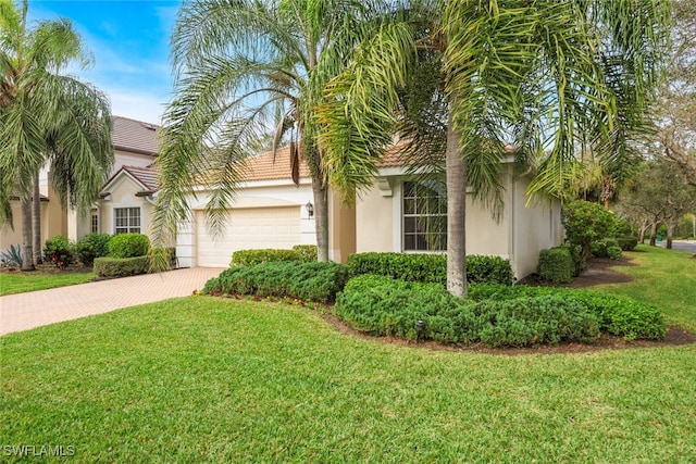 view of front of house with a front lawn and a garage