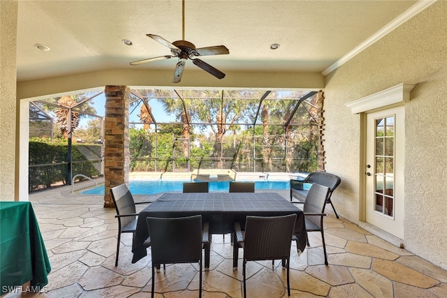 view of patio / terrace with ceiling fan, area for grilling, and a lanai