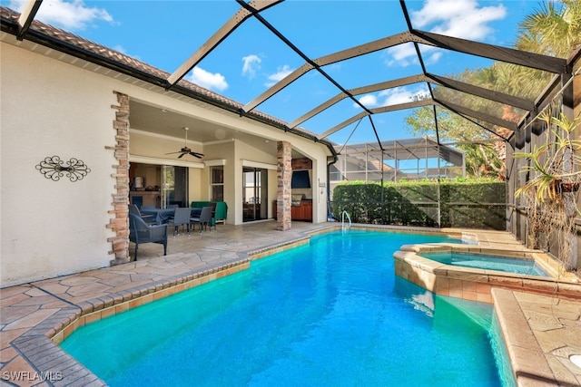 view of pool with ceiling fan, a lanai, an in ground hot tub, and a patio