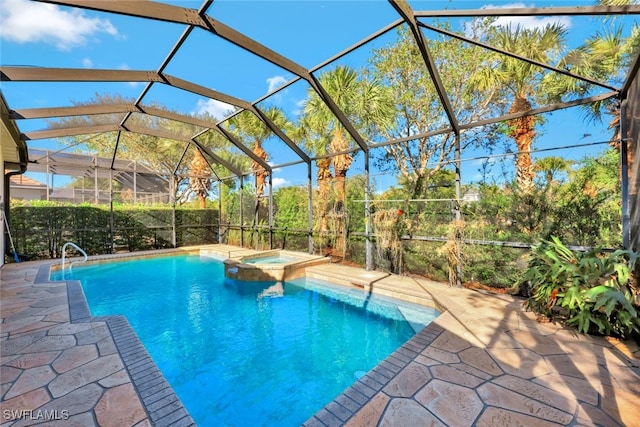 view of swimming pool with an in ground hot tub, a patio, and a lanai