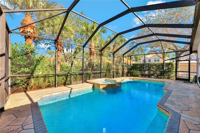 view of pool featuring a lanai, an in ground hot tub, and a patio