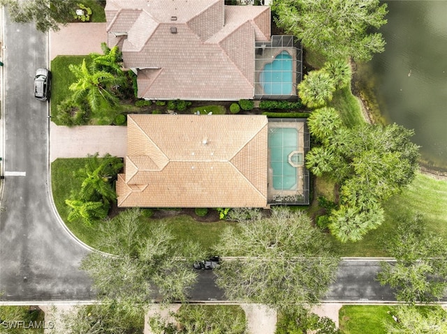 birds eye view of property with a water view