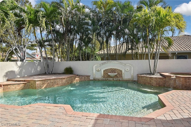 view of pool featuring a jacuzzi and pool water feature