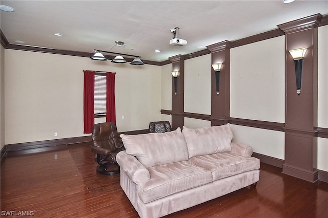 living room featuring dark wood-type flooring and ornamental molding