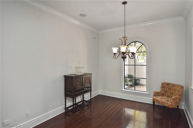 interior space with dark hardwood / wood-style flooring, a notable chandelier, and ornamental molding