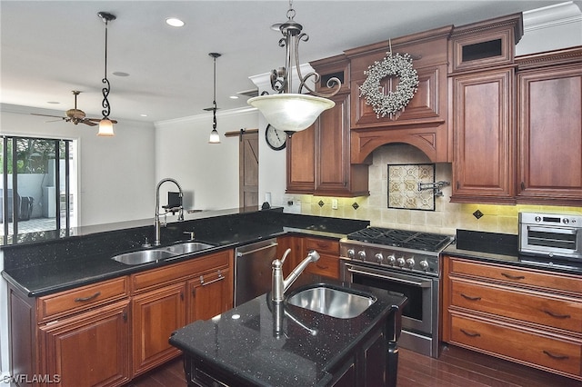 kitchen with appliances with stainless steel finishes, backsplash, ceiling fan, sink, and dark stone countertops