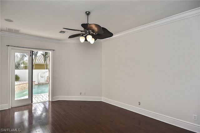 spare room with ceiling fan, dark hardwood / wood-style floors, and crown molding