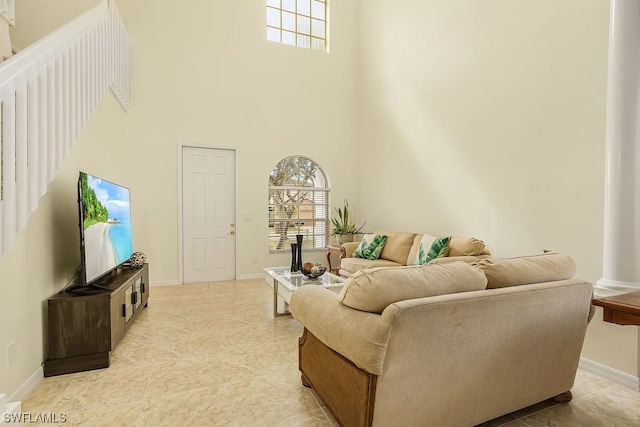 living room with a towering ceiling