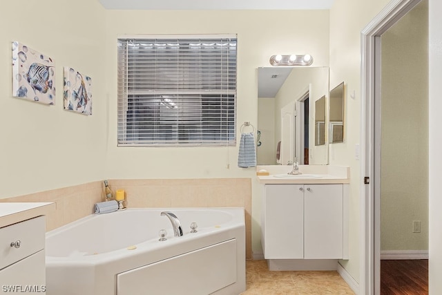 bathroom with a bath and vanity