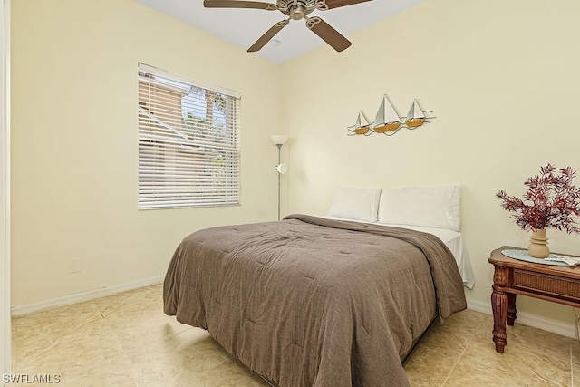 tiled bedroom with ceiling fan