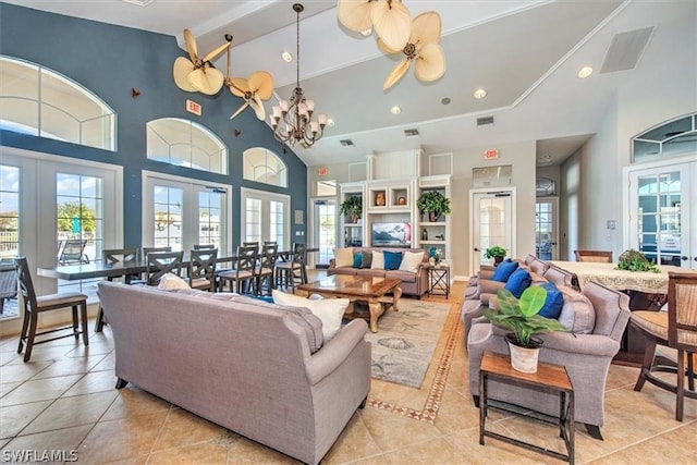 tiled living room with french doors, a healthy amount of sunlight, and a high ceiling