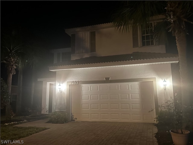 view of front of property with a garage