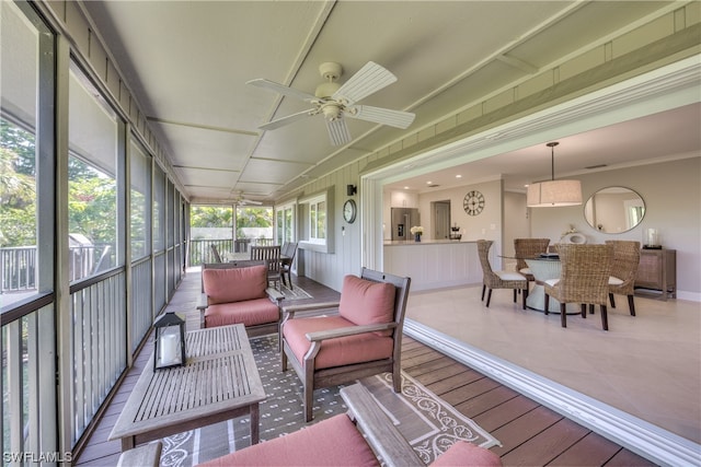 sunroom / solarium with ceiling fan