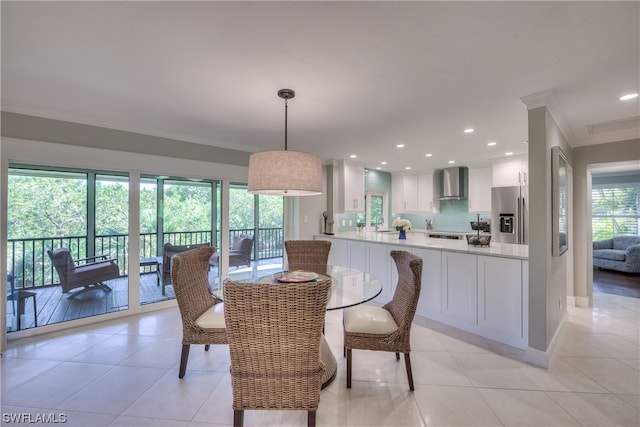 tiled dining space with crown molding