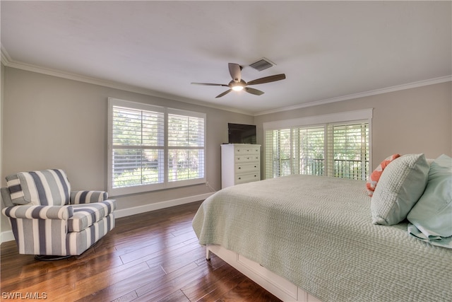 bedroom with crown molding, dark hardwood / wood-style floors, and ceiling fan