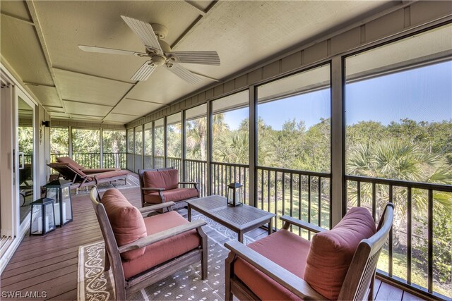 sunroom with ceiling fan and a wealth of natural light