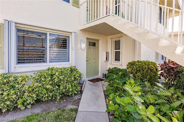 property entrance with a balcony