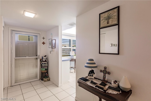 foyer featuring light tile floors