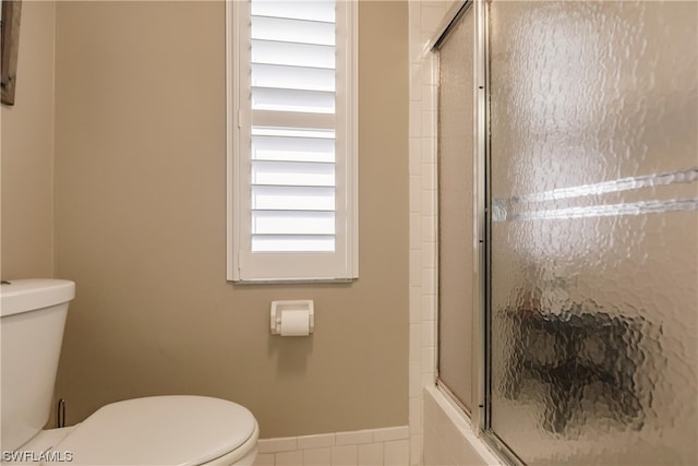 bathroom with tile floors and toilet