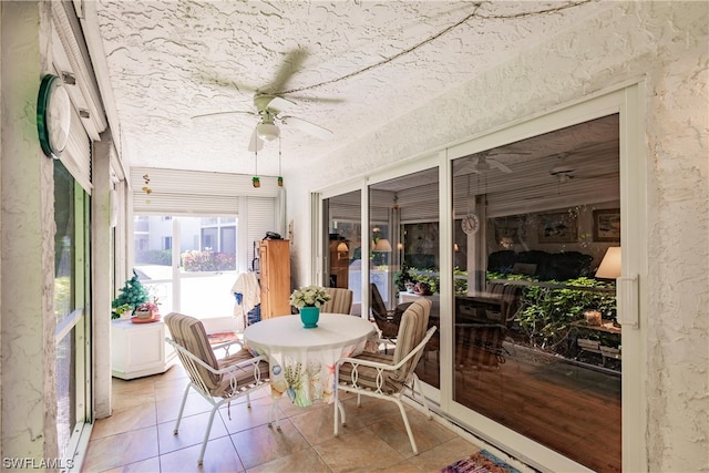 sunroom / solarium with ceiling fan