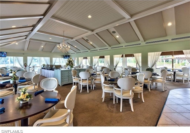 dining space with a chandelier, a wealth of natural light, tile flooring, and lofted ceiling with beams