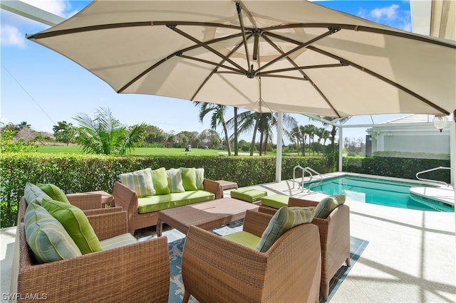 view of pool with a patio area and outdoor lounge area