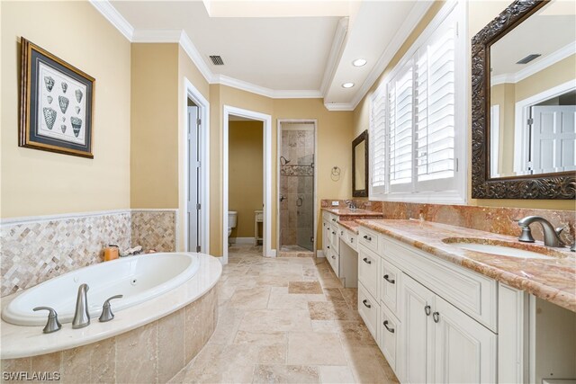 full bathroom with toilet, vanity, shower with separate bathtub, and ornamental molding