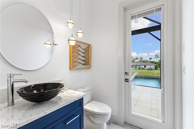 bathroom featuring vanity and toilet