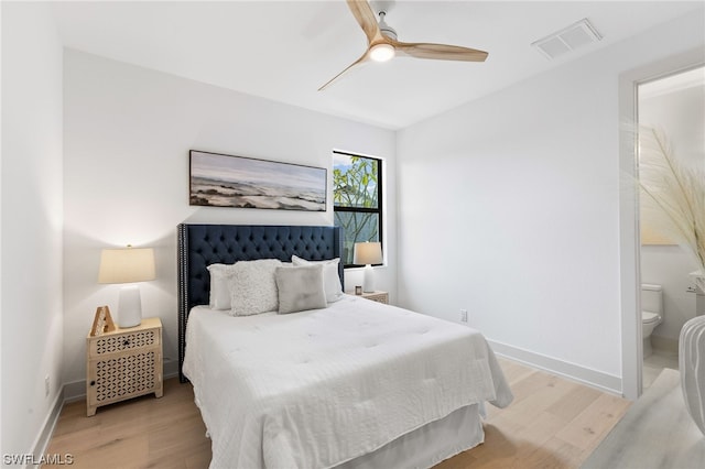 bedroom featuring ceiling fan, light wood-type flooring, and connected bathroom