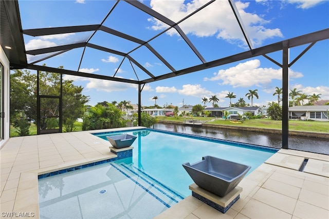 view of swimming pool featuring a patio area, a water view, and a lanai