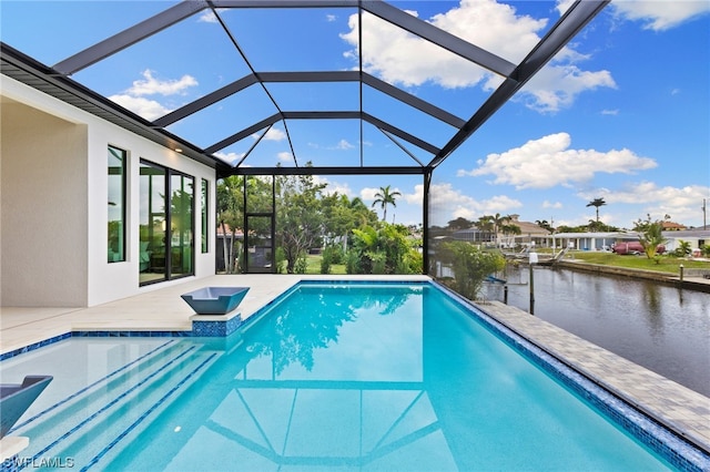 view of pool with a water view, a lanai, and a patio